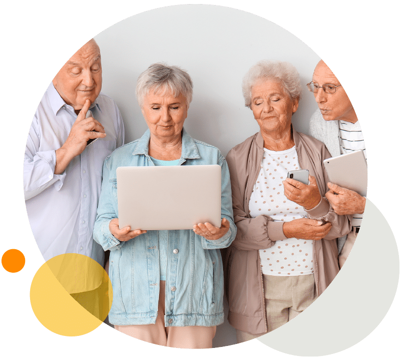 Eine Gruppe Senioren/innen erlernen den Umgang mit Handy, Tablet und Co. beim Techniktreff